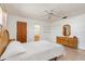 Inviting bedroom with neutral colors and an adjacent full bathroom at 7393 Mamouth St, Englewood, FL 34224