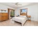 Comfortable bedroom featuring tile floors and a sliding glass door at 7393 Mamouth St, Englewood, FL 34224