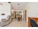 Bright dining room featuring tile floors, a classic wooden table, and ample natural light at 7393 Mamouth St, Englewood, FL 34224