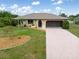 Charming single-story home with a well-maintained lawn and inviting curb appeal at 7393 Mamouth St, Englewood, FL 34224