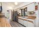 Well-lit kitchen featuring stainless steel appliances, wood countertops and a large window view at 7393 Mamouth St, Englewood, FL 34224