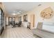 Bright, enclosed lanai featuring tile flooring, a dining table, and additional seating, great for gatherings at 7393 Mamouth St, Englewood, FL 34224
