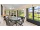 Enclosed outdoor living area with seating and scenic backyard views at 7393 Mamouth St, Englewood, FL 34224