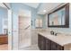 Bathroom featuring new vanity and walk in shower with glass door at 867 Cascade Ct, Englewood, FL 34223