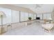 Bright sunroom with white tile floor and lots of windows at 867 Cascade Ct, Englewood, FL 34223