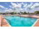 Large community pool with ample seating and a well-maintained pool deck, perfect for relaxation at 878 Fawnspring Ct, Englewood, FL 34223