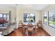 Charming dining area featuring wood table, chairs and good natural light from the windows at 878 Fawnspring Ct, Englewood, FL 34223