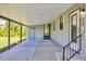 Spacious, covered patio offering ample space for outdoor seating and entertaining at 878 Fawnspring Ct, Englewood, FL 34223