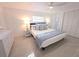Serene bedroom with a comfortable bed, soft lighting, and ample closet space at 95 Coquina Ln, Englewood, FL 34223