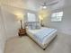 Comfortable bedroom featuring a cozy bed, soft lighting, and calming decor at 95 Coquina Ln, Englewood, FL 34223