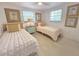 Charming bedroom with twin beds, stylish decor, and ample natural light at 95 Coquina Ln, Englewood, FL 34223