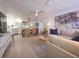Bright living room showcasing a comfortable sofa, stylish decor, and an open concept floor plan at 95 Coquina Ln, Englewood, FL 34223
