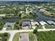 Beautiful aerial shot of home with canal access, boat dock, and surrounding residences at 10048 Winnipeg St, Port Charlotte, FL 33981
