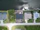 Birds eye view of a waterfront lot featuring home under construction, canal access, and stunning surroundings at 10048 Winnipeg St, Port Charlotte, FL 33981