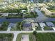A waterfront property featuring a modern home under construction with canal access and lush surroundings at 10048 Winnipeg St, Port Charlotte, FL 33981