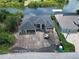 Aerial view of home with water access and a dock, located in a lush, tropical area at 10048 Winnipeg St, Port Charlotte, FL 33981
