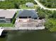 A waterfront lot featuring a home under construction, pool area, and canal access at 10048 Winnipeg St, Port Charlotte, FL 33981
