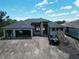 New construction home featuring a modern design with a large garage and spacious layout at 10048 Winnipeg St, Port Charlotte, FL 33981