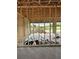 Spacious garage under construction, framed and ready for finishing, with ample room for vehicles and storage at 10048 Winnipeg St, Port Charlotte, FL 33981