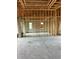 Under construction living room featuring the stud framed wall and beams, plus views to the exterior of the home at 10048 Winnipeg St, Port Charlotte, FL 33981