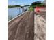 Cleared waterfront lot, ready for construction, with a boat dock on a canal at 10048 Winnipeg St, Port Charlotte, FL 33981