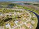 Expansive aerial view of a residential community featuring single-Gathering homes, canals, and natural Florida landscapes at 116 Tournament Rd, Rotonda West, FL 33947