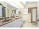 Bright bathroom featuring double sinks at 116 Tournament Rd, Rotonda West, FL 33947
