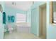 Bright bathroom features a tub, tiled shower, and modern fixtures, offering a refreshing and stylish space at 116 Tournament Rd, Rotonda West, FL 33947