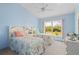 Bright bedroom with a window offering a lovely view at 116 Tournament Rd, Rotonda West, FL 33947