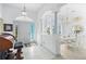 Bright foyer with tile flooring, white pillars, and a view into the dining area at 116 Tournament Rd, Rotonda West, FL 33947