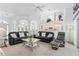 Spacious living room with high ceilings, comfortable seating, and an open view to the kitchen at 116 Tournament Rd, Rotonda West, FL 33947