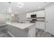 Bright kitchen with stainless appliances, granite countertops, and an island with a sink at 12 Current Ln, Placida, FL 33946
