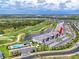 Aerial view of the community featuring residences, a golf course, lakes, and a swimming pool at 12470 Wellen Golf St # 108, Venice, FL 34293