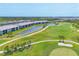 Breathtaking aerial view of condo community situated along a pristine golf course and a lake at 12470 Wellen Golf St # 108, Venice, FL 34293