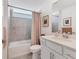 Well-lit bathroom featuring a tub, shower, updated vanity with a clean, modern design at 12470 Wellen Golf St # 108, Venice, FL 34293
