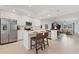 A new kitchen featuring a large center island, stainless steel appliances and an open floor plan at 12470 Wellen Golf St # 108, Venice, FL 34293
