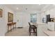 Bright, modern kitchen with an island, stainless steel appliances and pendant lighting at 12470 Wellen Golf St # 108, Venice, FL 34293