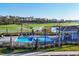 Community pool area overlooking a golf course and lush landscape, perfect for relaxation at 12470 Wellen Golf St # 108, Venice, FL 34293