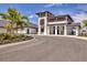Exterior view of the community pro shop featuring modern architecture, attractive landscaping, and convenient parking at 12470 Wellen Golf St # 108, Venice, FL 34293