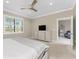 Bedroom with neutral walls, ceiling fan, and a window with natural light at 13859 Vadini St, Venice, FL 34293