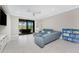 Spacious living room with a blue leather sectional and bright decor at 13859 Vadini St, Venice, FL 34293