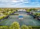 Multiple tennis courts with covered rest areas for players' comfort and convenience at 13859 Vadini St, Venice, FL 34293
