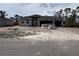 New construction home with a spacious three car garage and block construction at 14 Current Ln, Placida, FL 33946