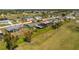 Aerial view of home highlighting the screened in lanai and large backyard at 146 Rotonda Cir, Rotonda West, FL 33947