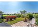 Charming backyard featuring a patio with scenic views of the golf course and lush landscaping at 146 Rotonda Cir, Rotonda West, FL 33947