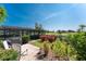 Inviting backyard featuring a patio, outdoor grill and views of the golf course beyond at 146 Rotonda Cir, Rotonda West, FL 33947