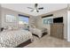 Guest bedroom featuring two beds, a ceiling fan, and natural light from two windows at 146 Rotonda Cir, Rotonda West, FL 33947