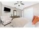 Comfortable bedroom featuring a ceiling fan, dresser, armchair, and closet for ample storage at 146 Rotonda Cir, Rotonda West, FL 33947