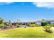 Well-maintained single-Gathering home with a lush lawn and colorful landscaping at 146 Rotonda Cir, Rotonda West, FL 33947