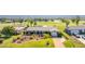 Attractive home featuring a well-manicured lawn, neat landscaping, and a two-car garage at 146 Rotonda Cir, Rotonda West, FL 33947